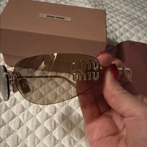 Miu Miu Women's Sunglasses with Gold Tint